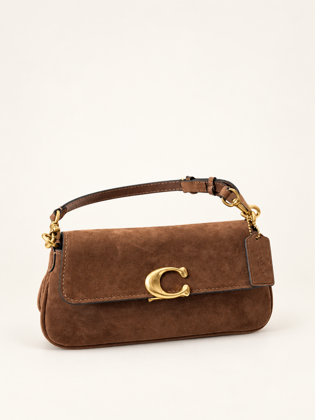 Coach Suede Jet חום – חזית על רקע שנהב